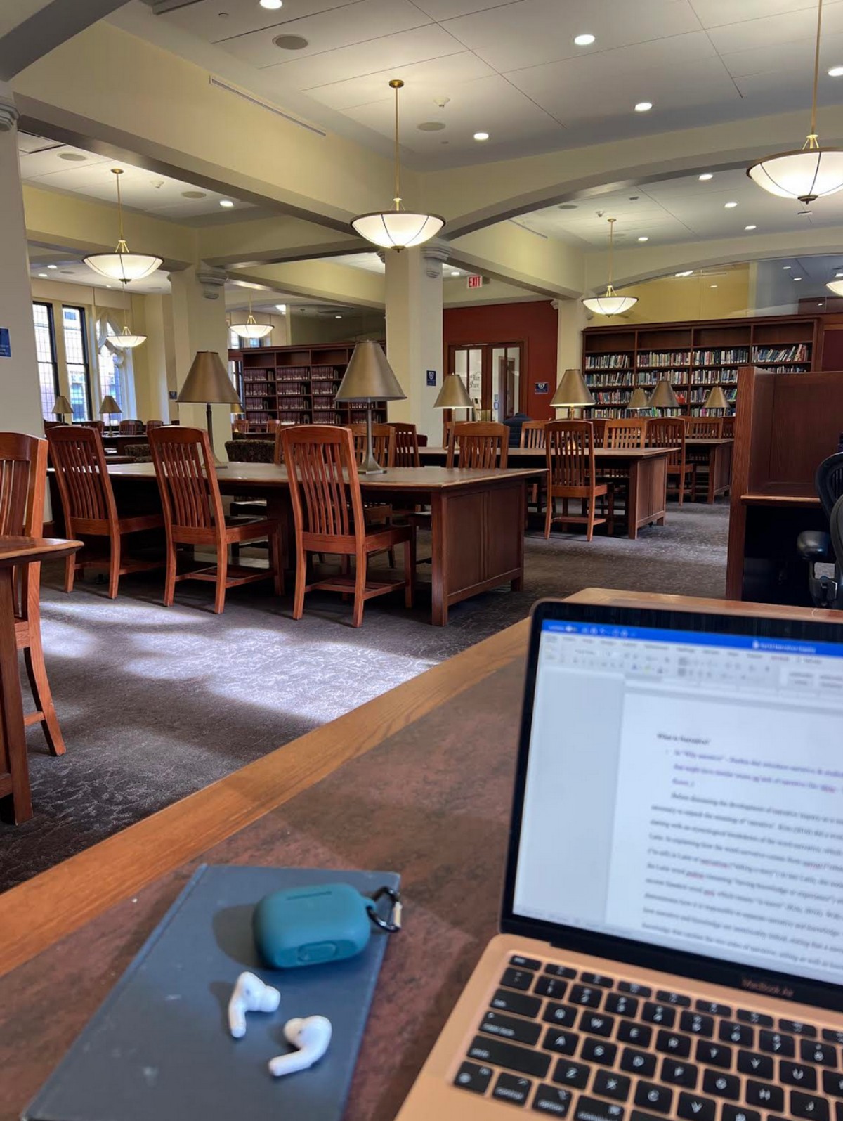 A laptop sitting on a table in the TC library