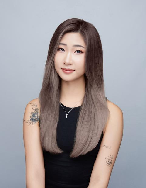 Janice smiling at camera.