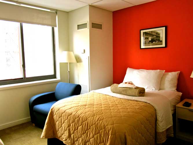 View of guest room with red accent wall