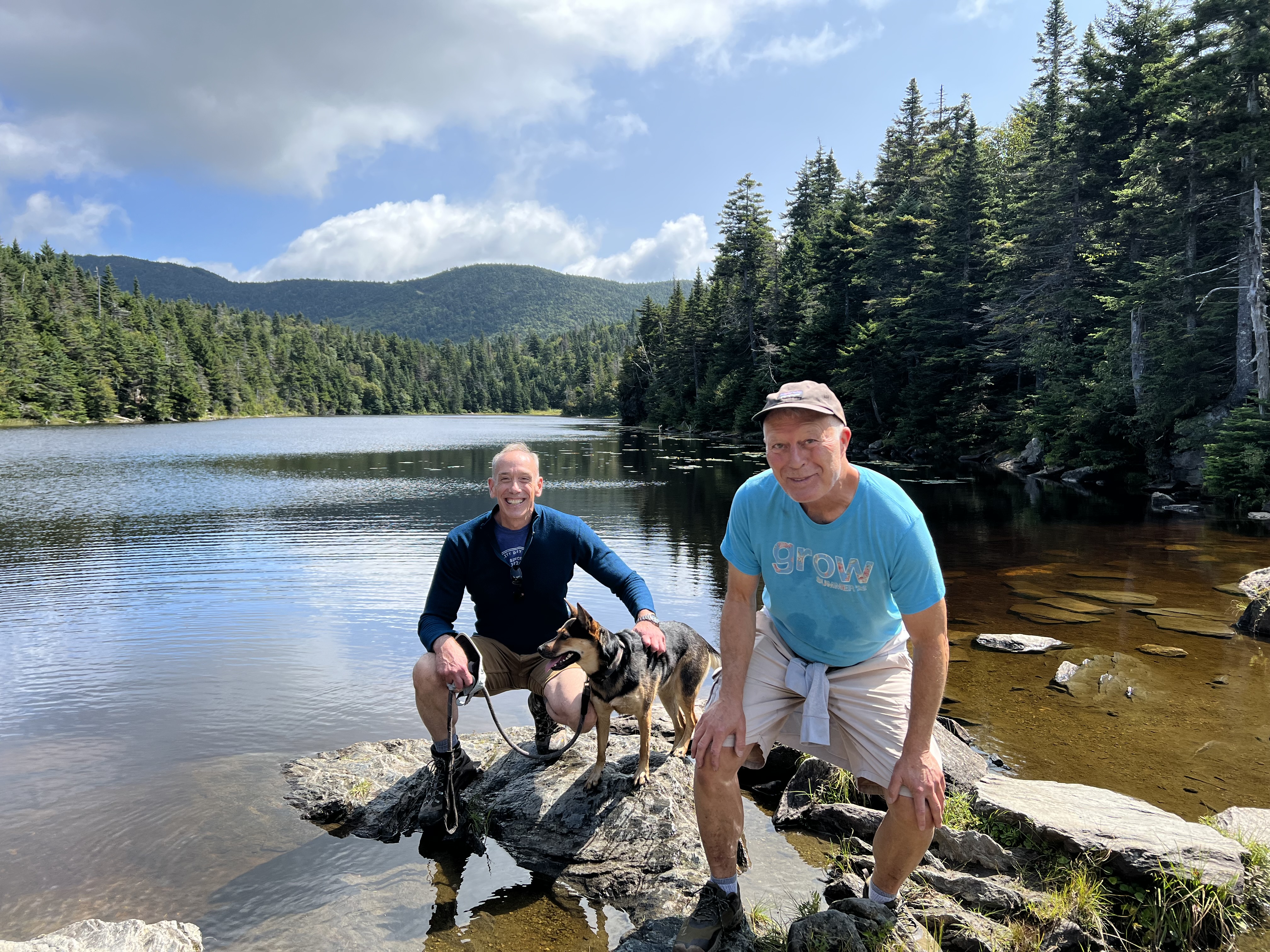Dr. Brock with Partner Bill and their dog Zora (Photo Courtesy of Dr. Brock)