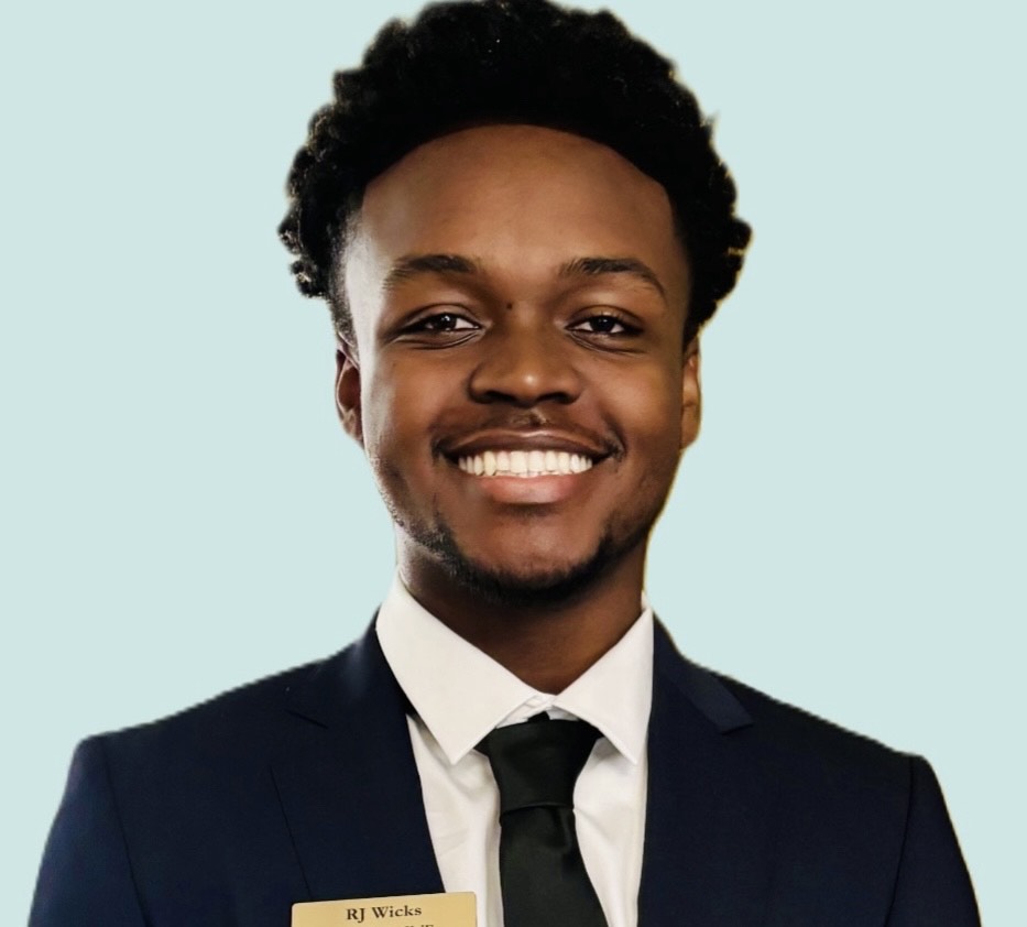 Student headshot with a light blue background