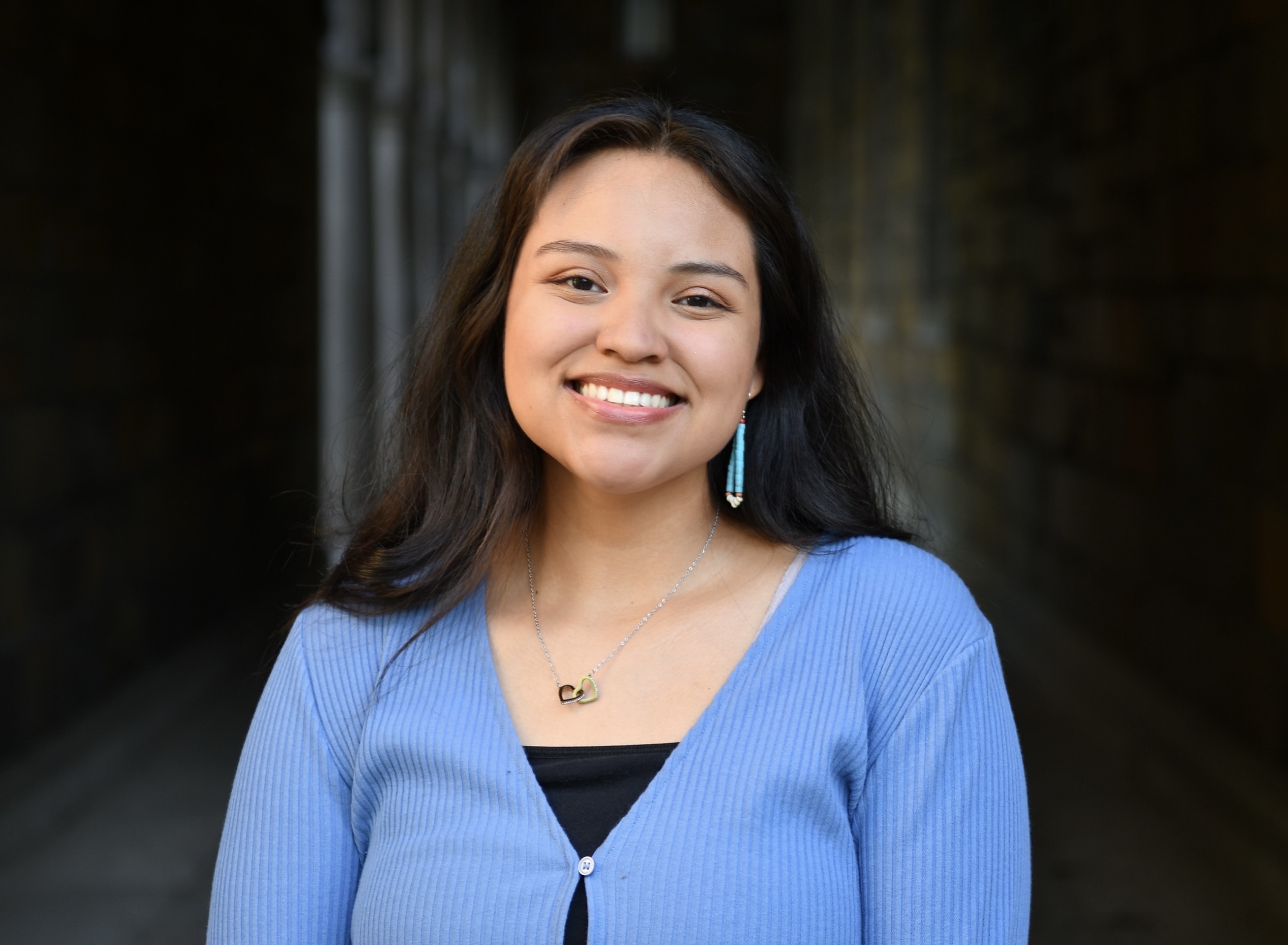 Headshot of student with a black background