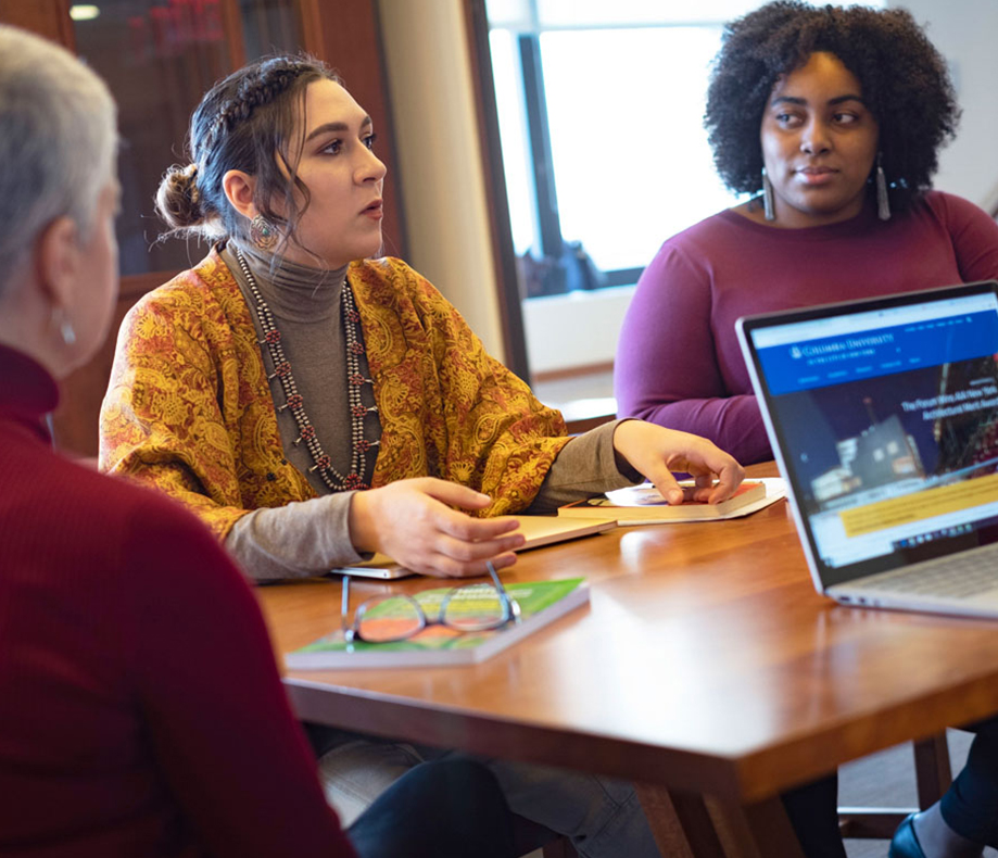 Group sitting and talking at a table