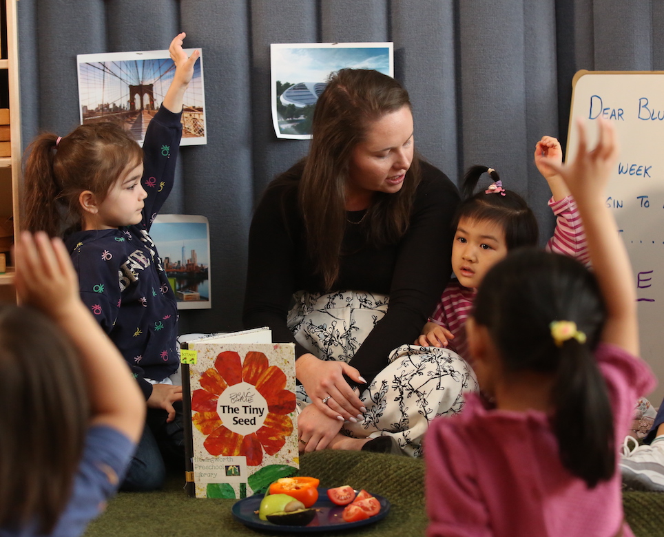 A TC student teaches a class of children