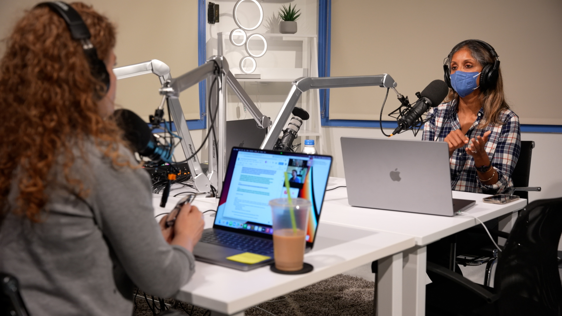 Jen Lee and Sonali Rajan at Macy Studio B podcasting microphones