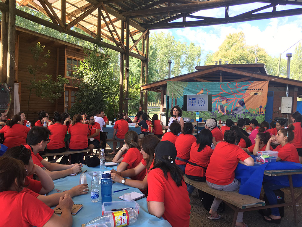 Woman giving presentation to group of teachers