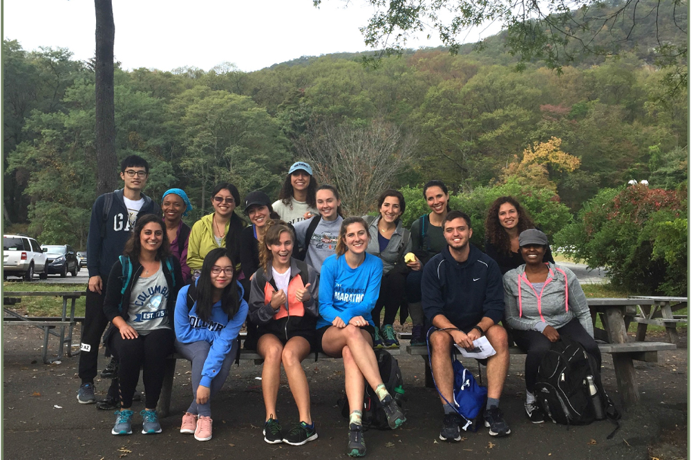 Nutrition students pose for a picture after a hike outside.