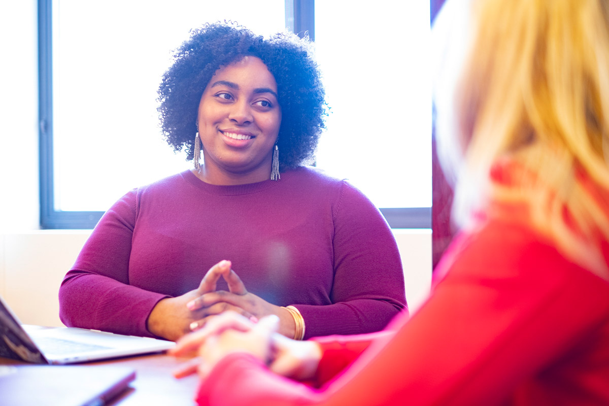 A student is engaged in conversation with one her peers at a study group at Teachers College.