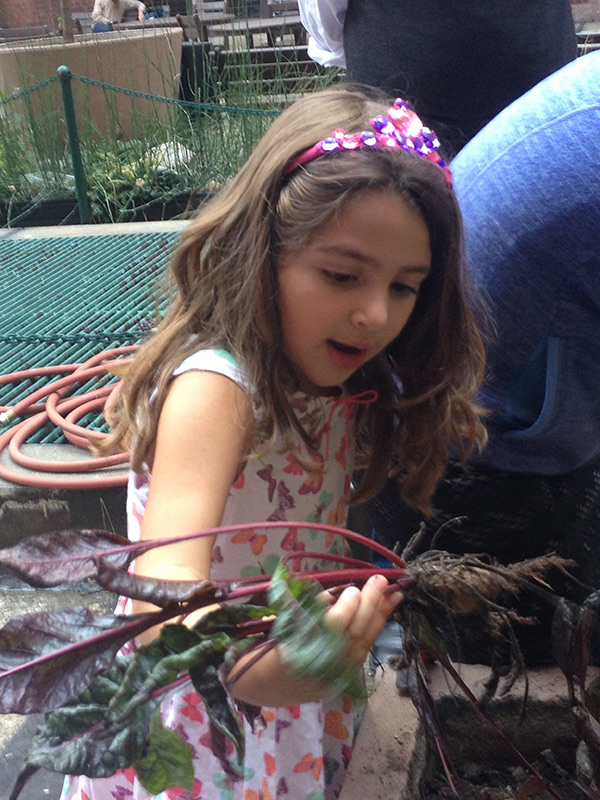 Girl with beet in Russell Courtyard