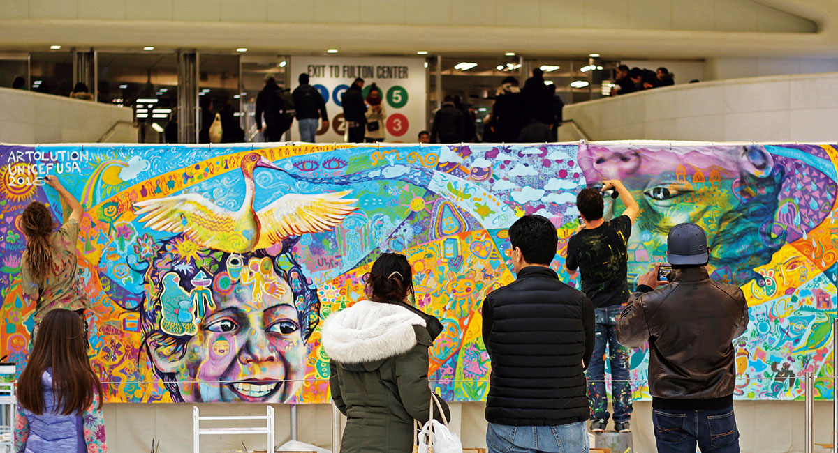 Max Frieder and students paint a mural at the Oculus