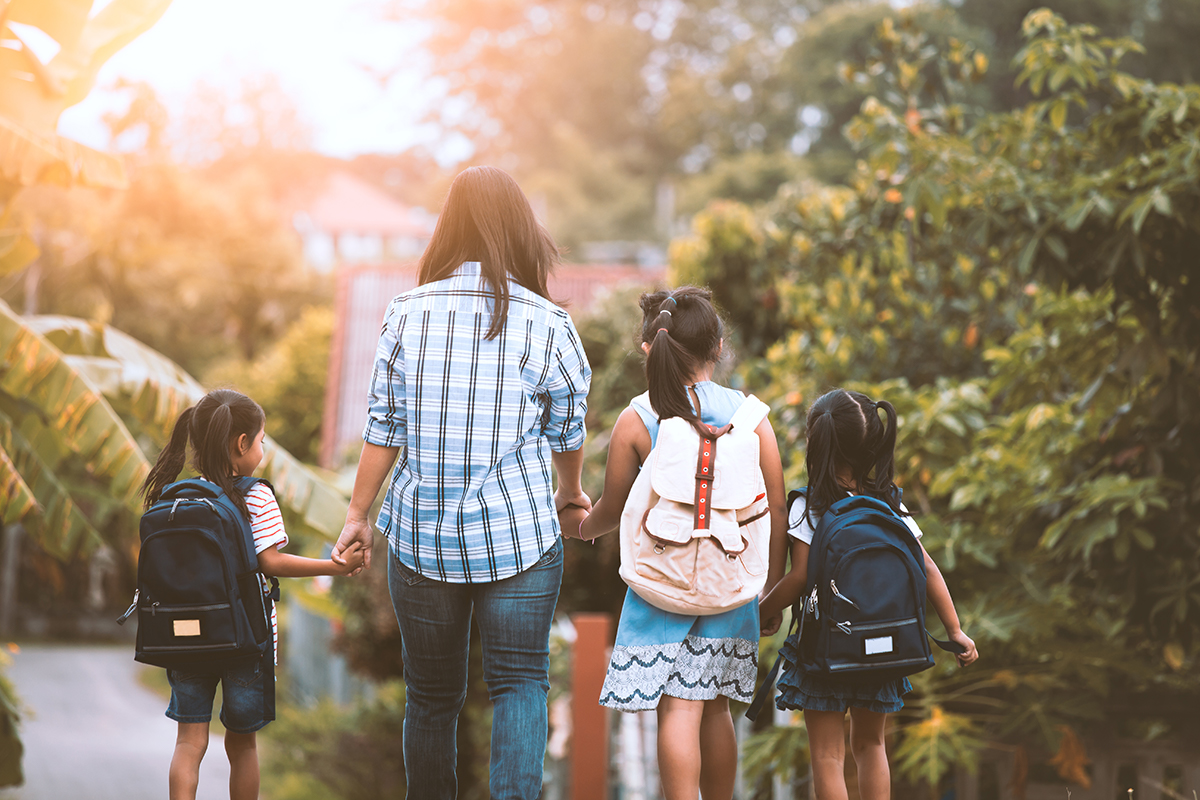 Parent bringing children to school