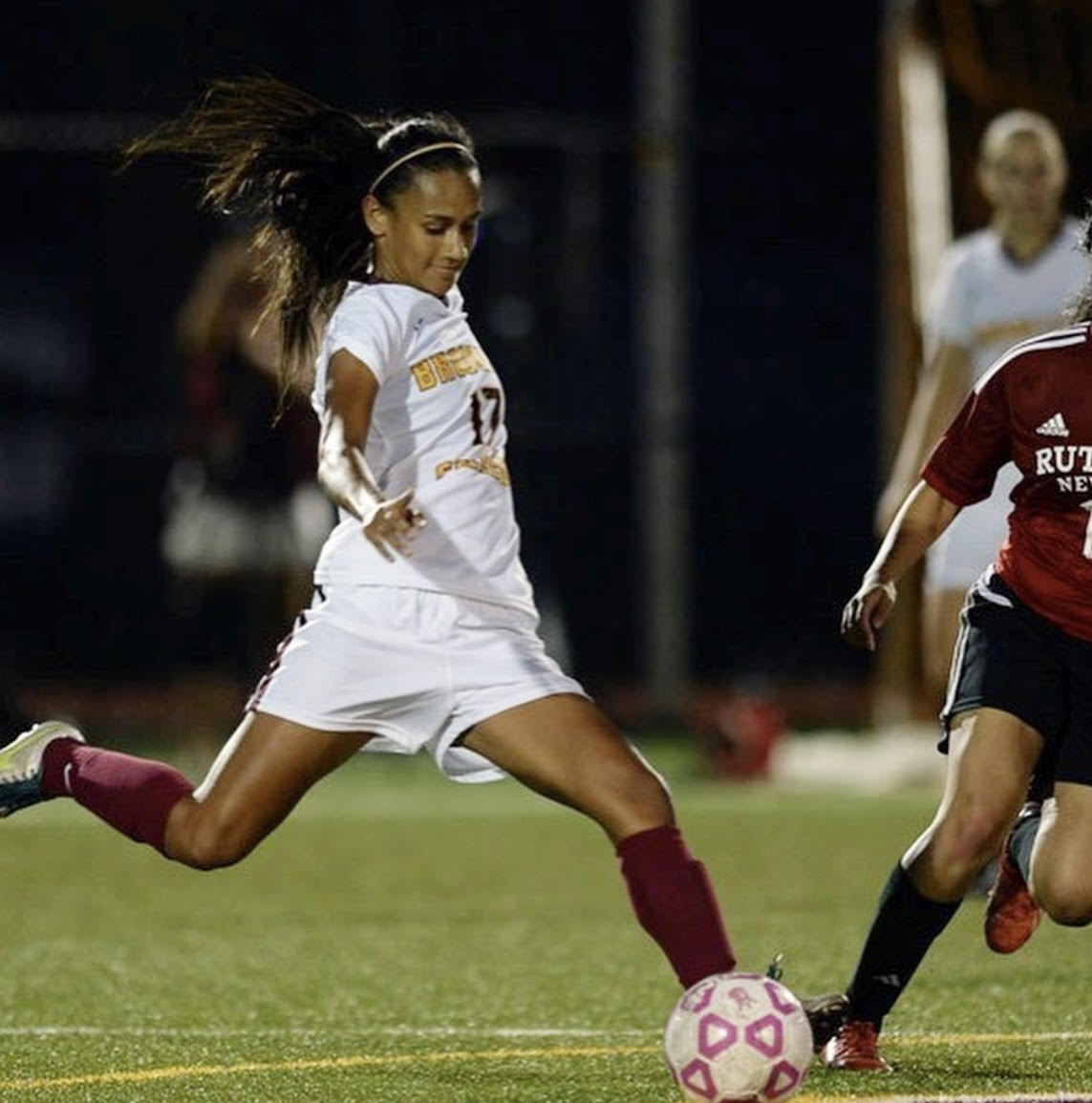 Shani playing soccer during a tournament