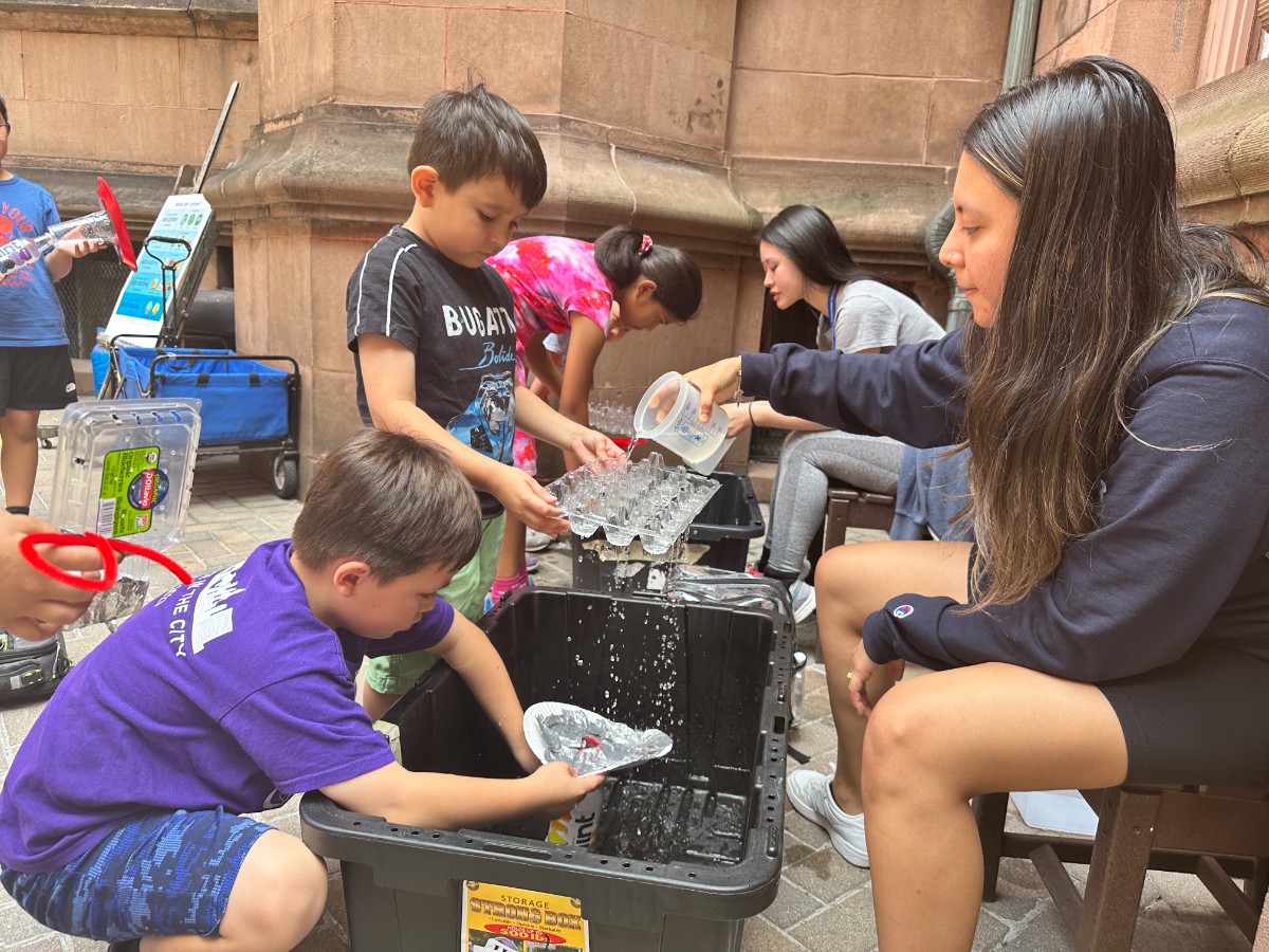 Campers participate in activities about rainwater.