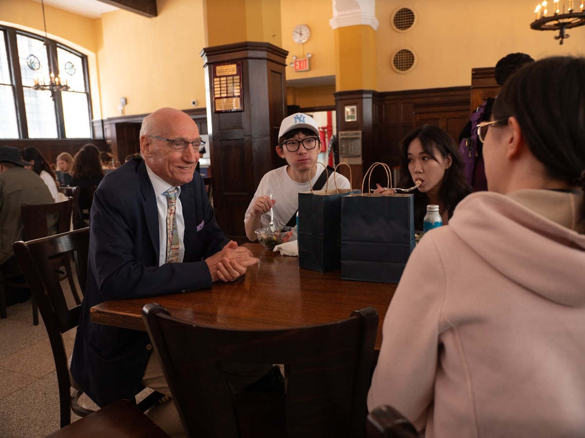 President Tom Bailey chats with new students.