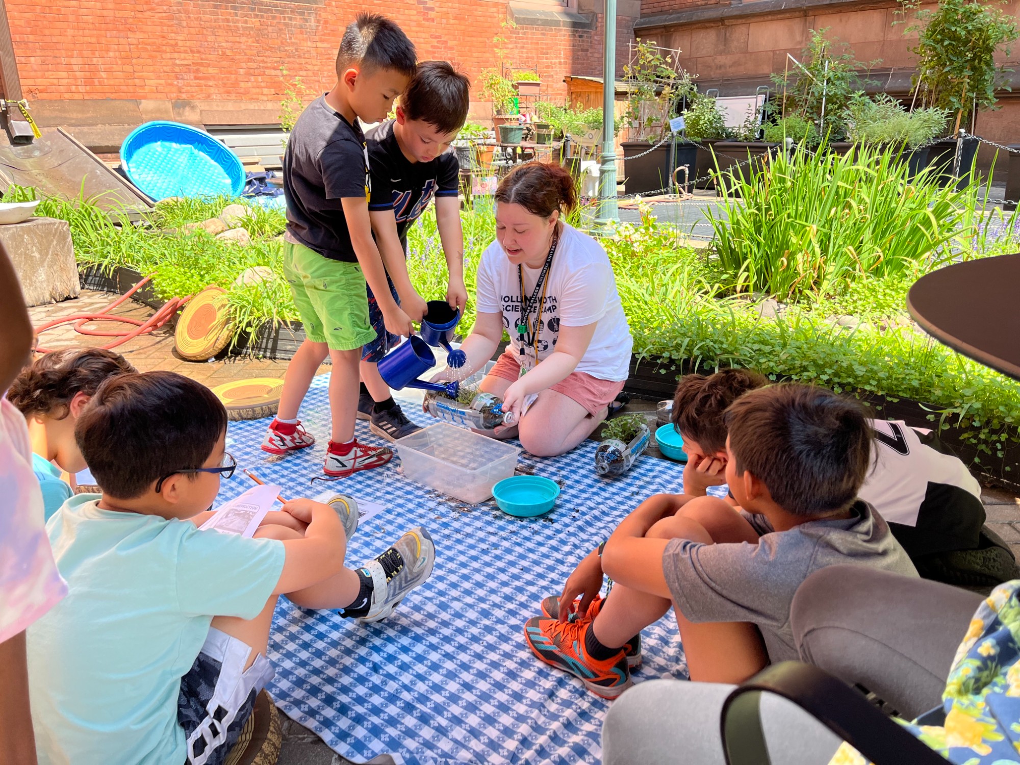 Students engage in a rainwater simulation activity.