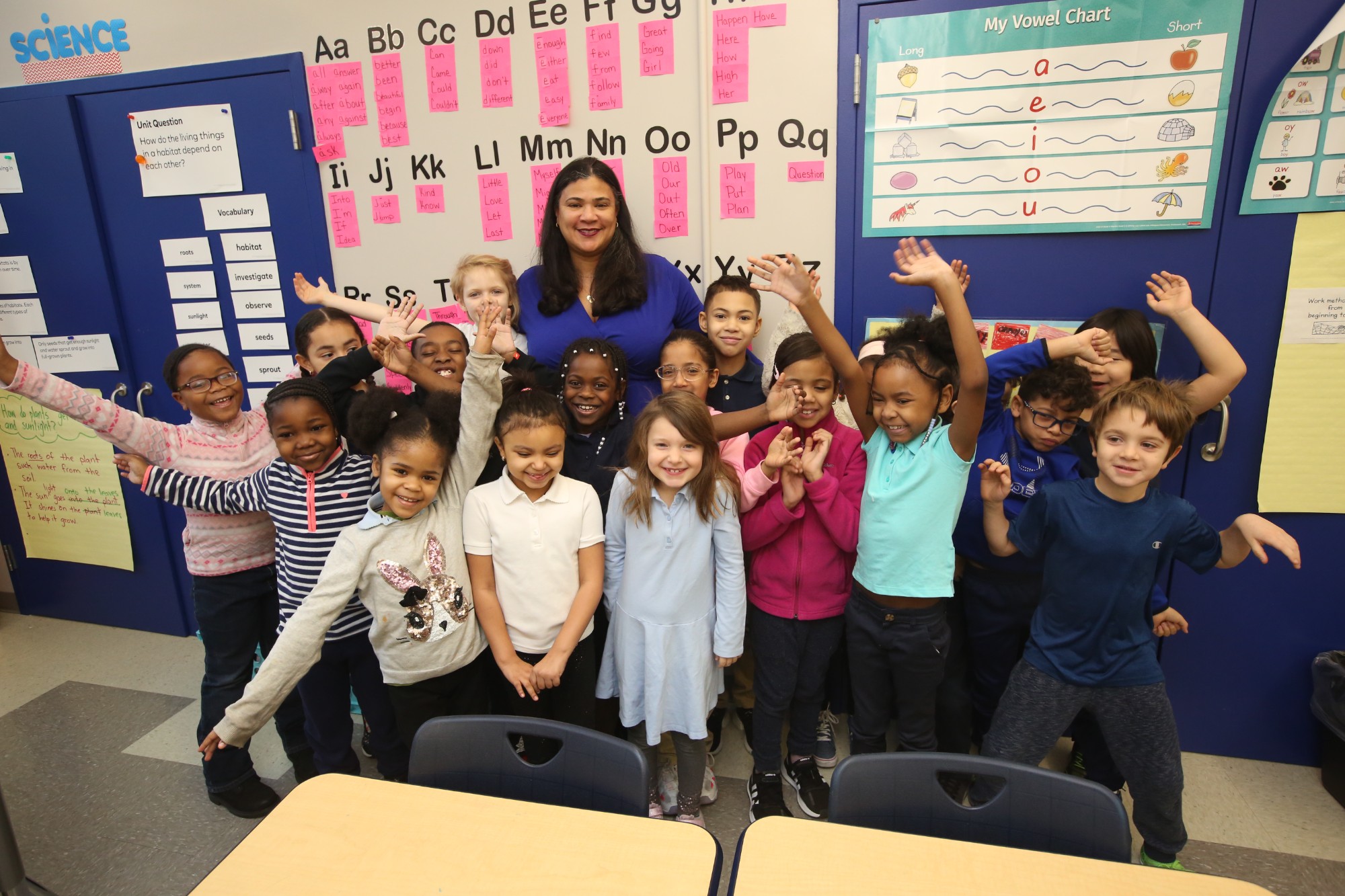 Students smiling with teacher