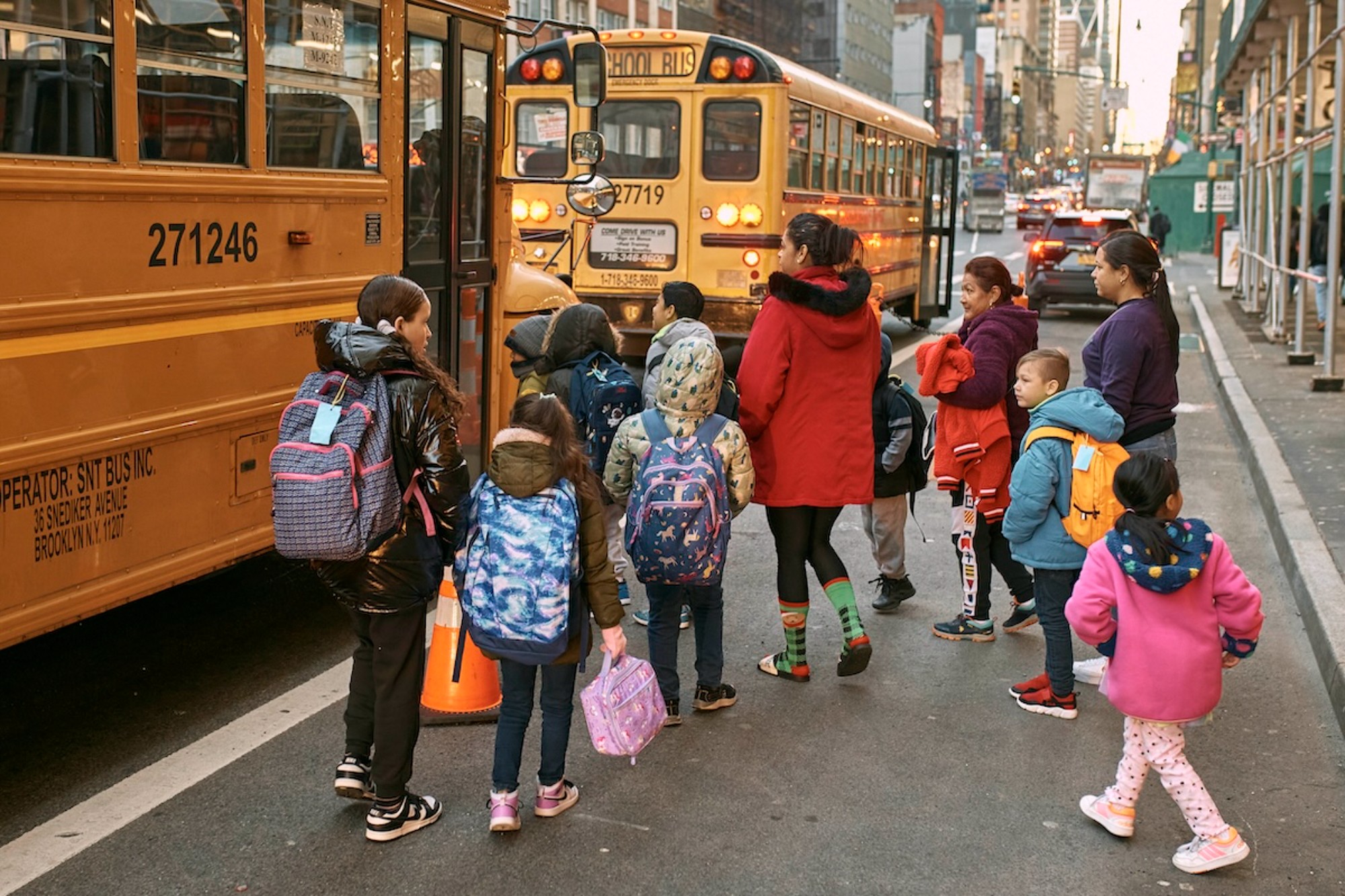 Students approach school buses in NYC