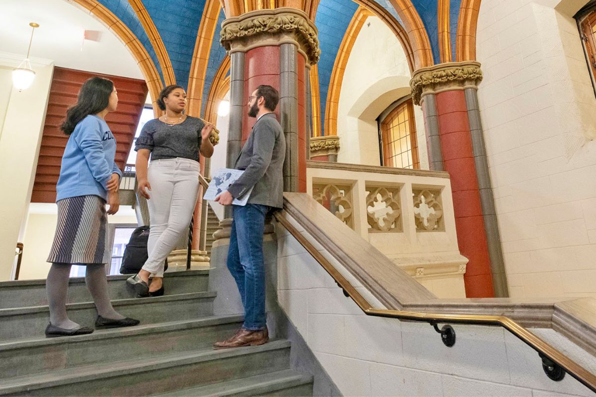 students and faculty talking in russell hall