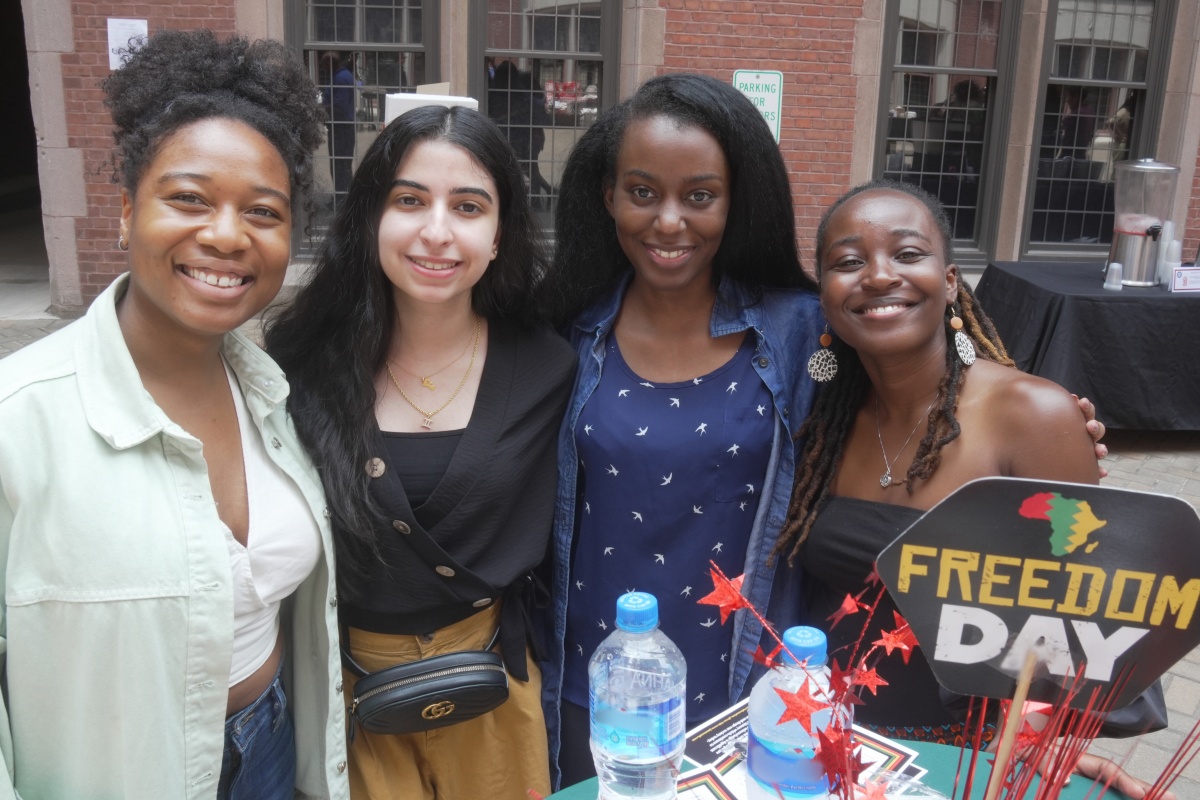 Students smiling at the 2023 Juneteenth BBQ