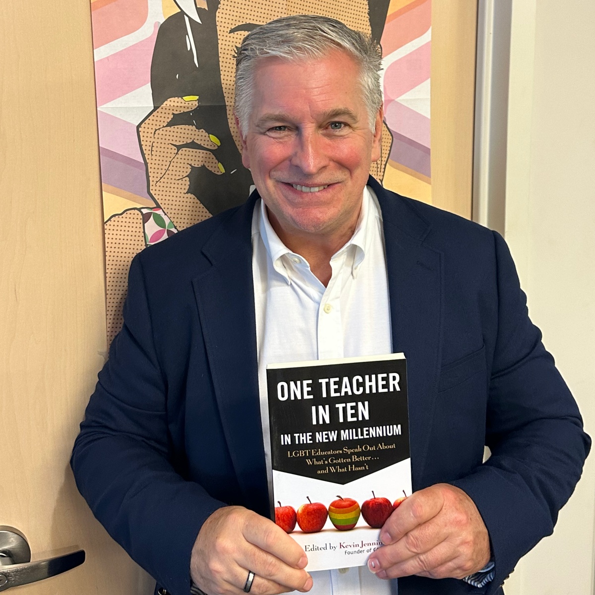 Alum Kevin Jennings with his book