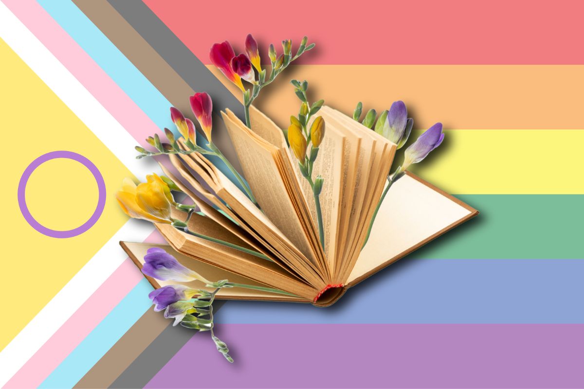 Flowers emerge from the pages of an open book, showing against a Pride flag