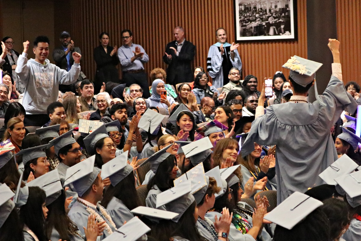 family cheers for grad