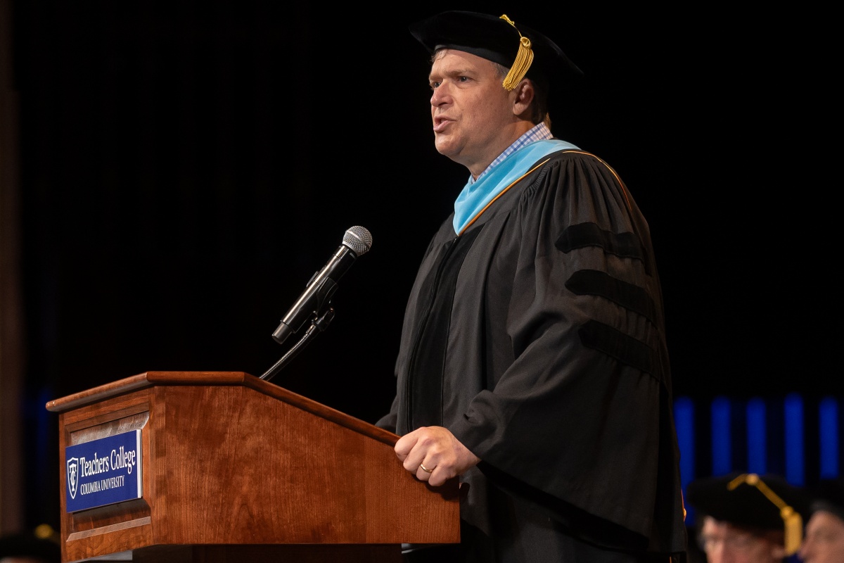 Brian Kennerly, president of the Alumni Council, addresses graduates