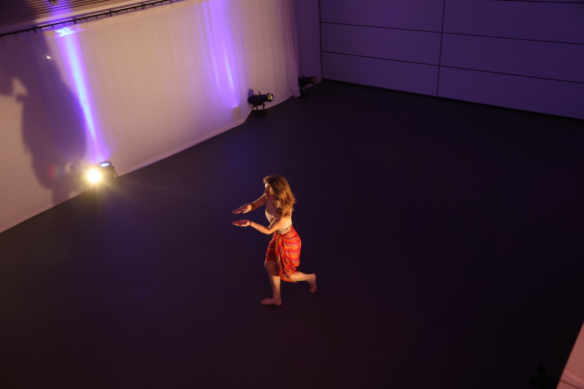 Dancer performs in an open studio