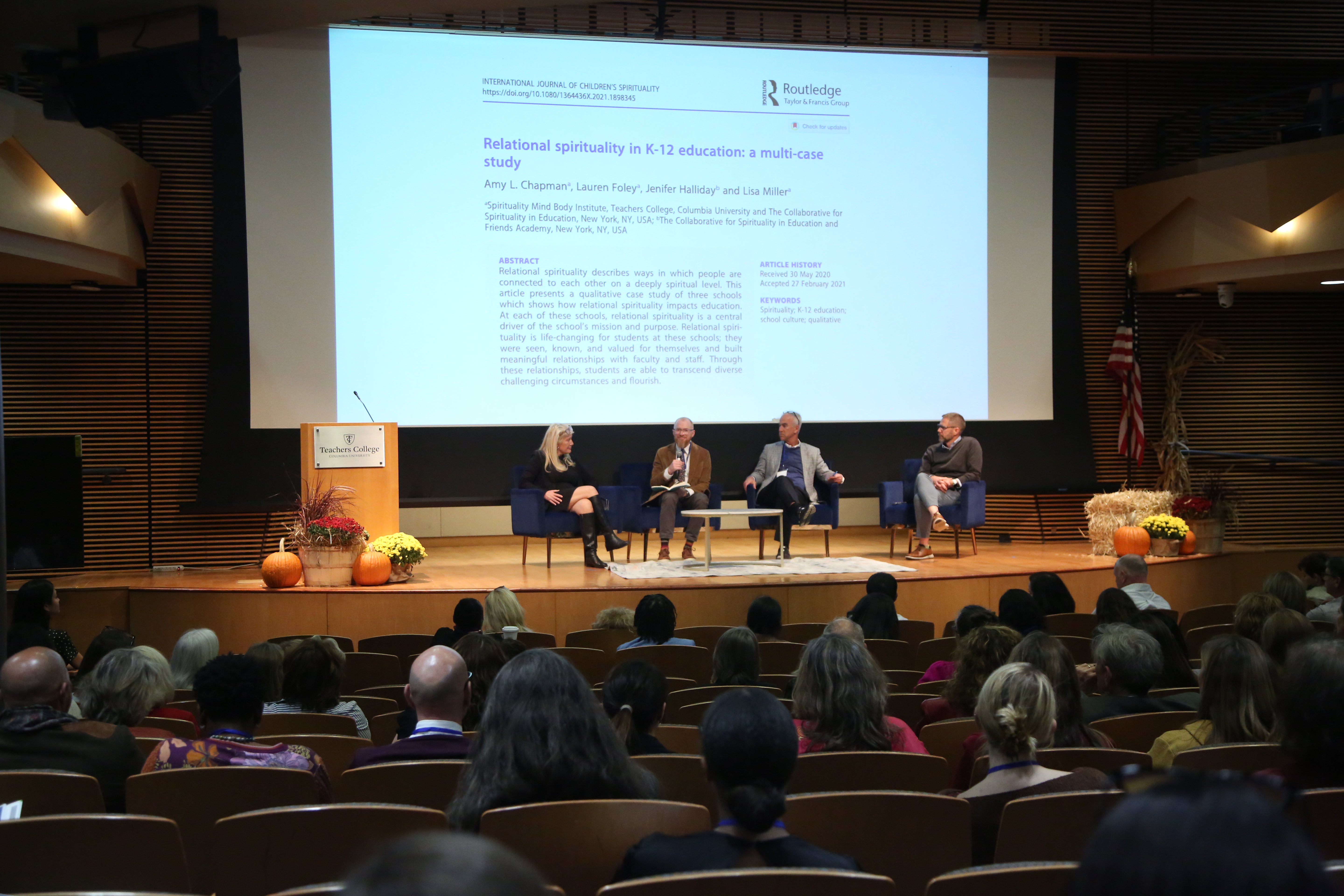 Miller conversing with keynote speakers.