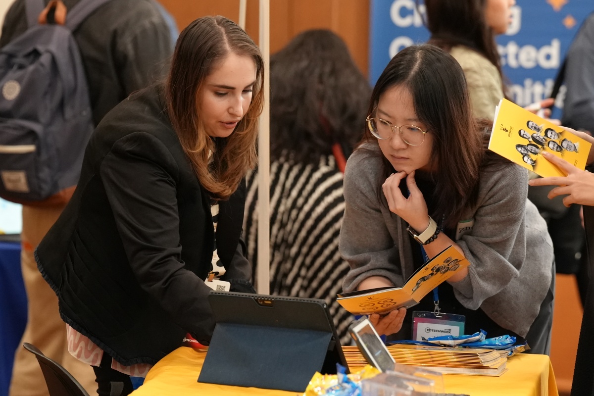 A TC student speaks with an employer during EdTech Week 2024.