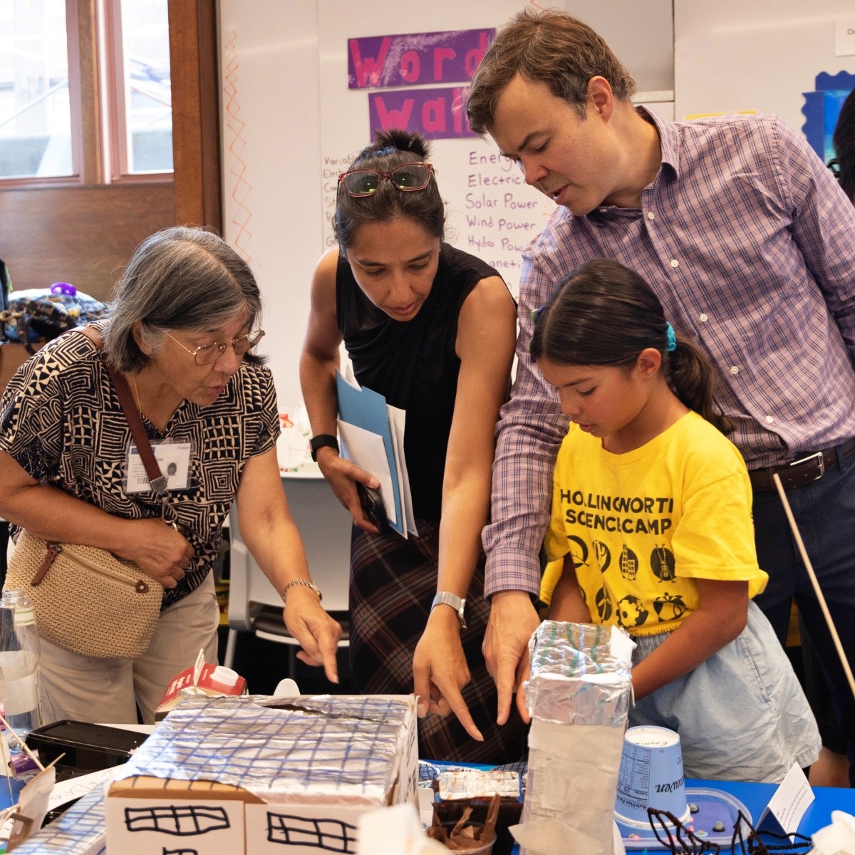 Family with student at Hollingworth Sceince Camp expo