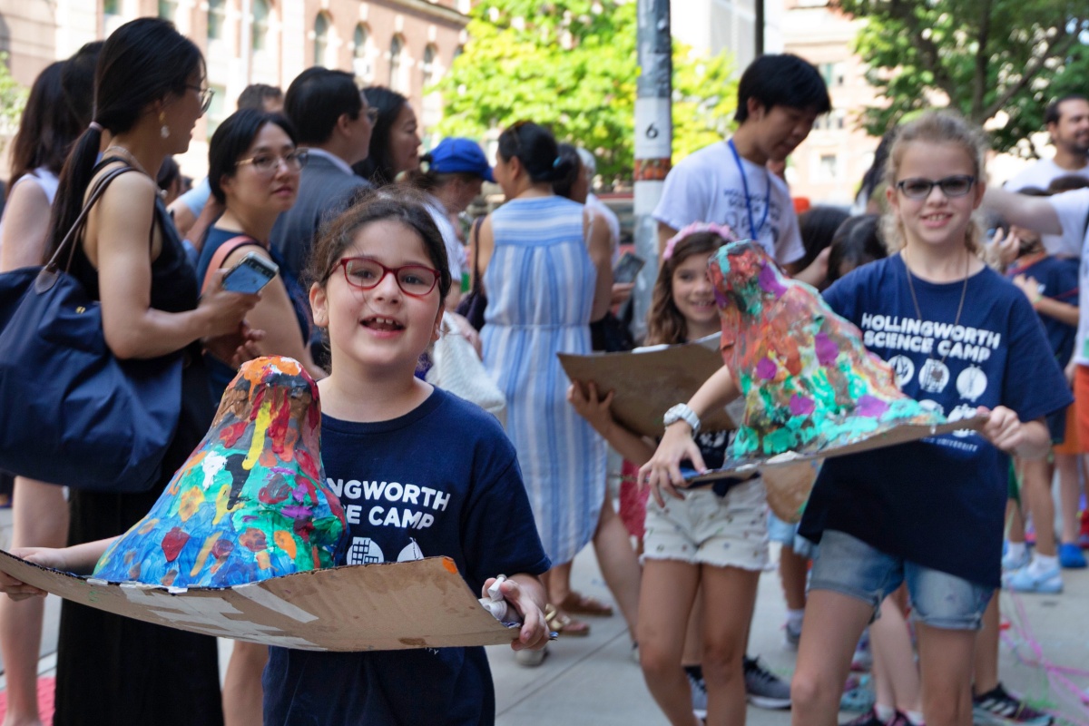 Campers share their paper-mache volcanos