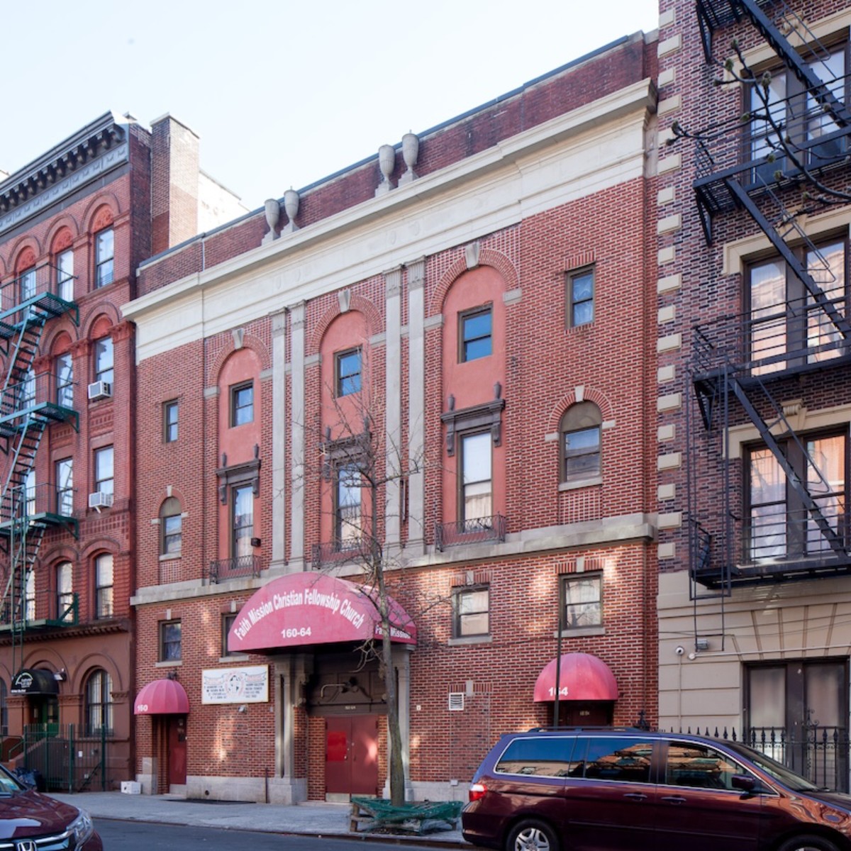 Exterior of athree story brick building