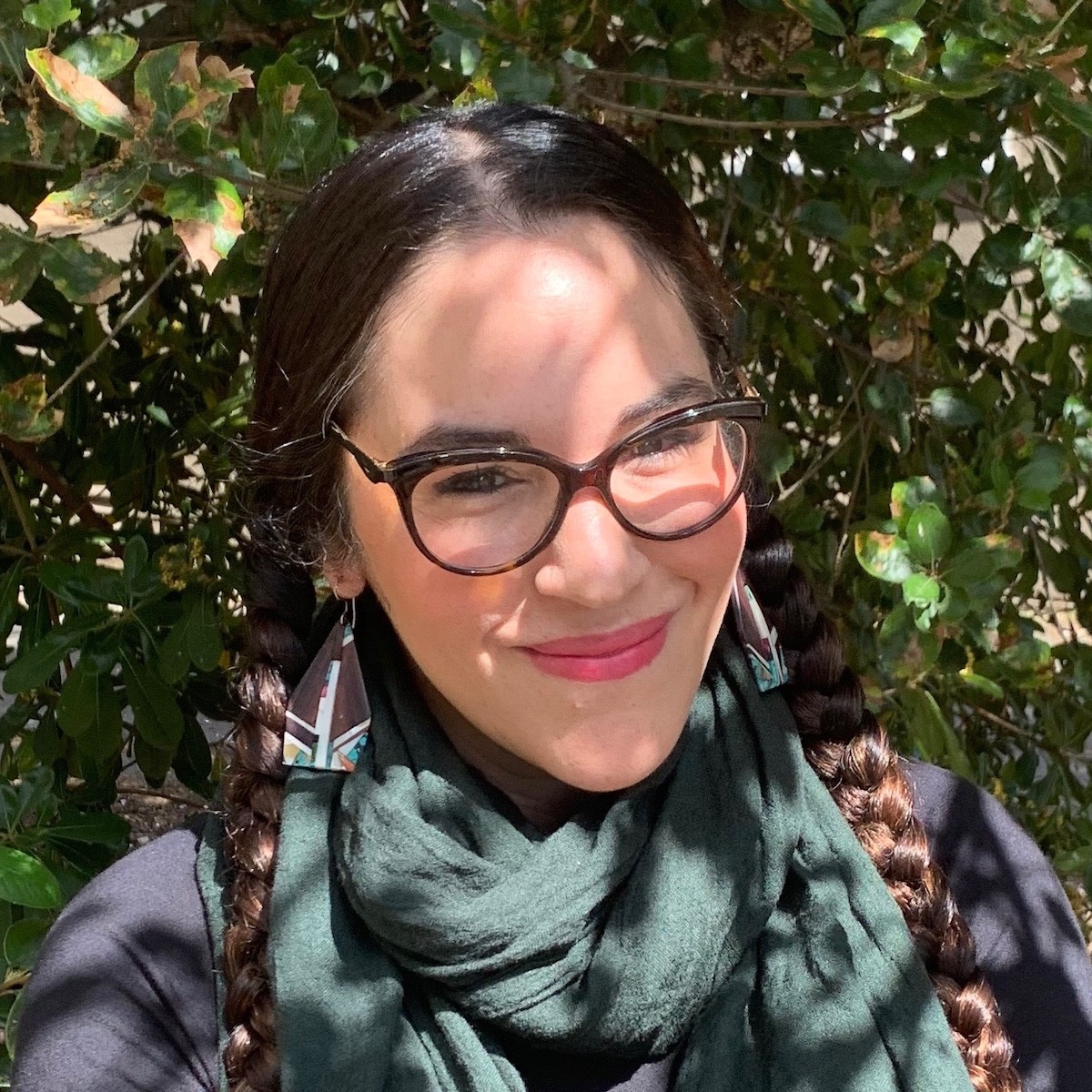 Cati V. de los rios sitting under a tree