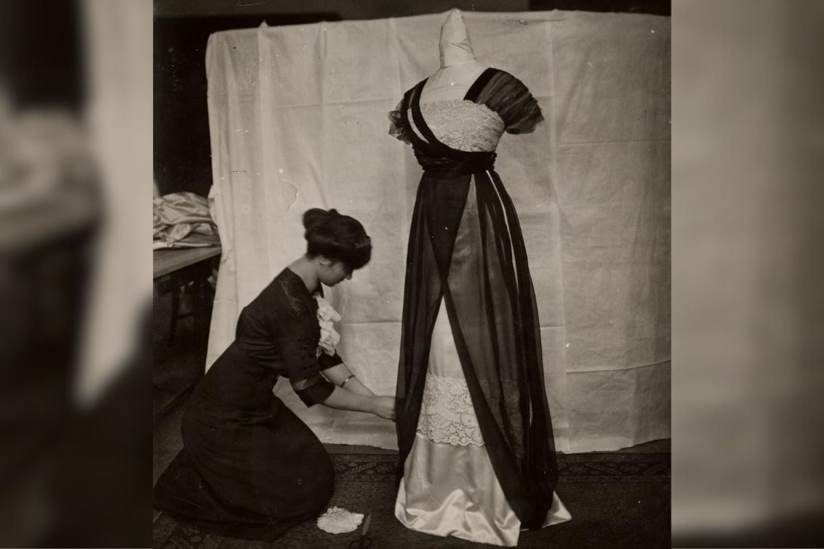 archive image of TC student draping a dress
