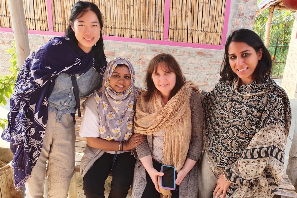 Verdeli smiling with three other women
